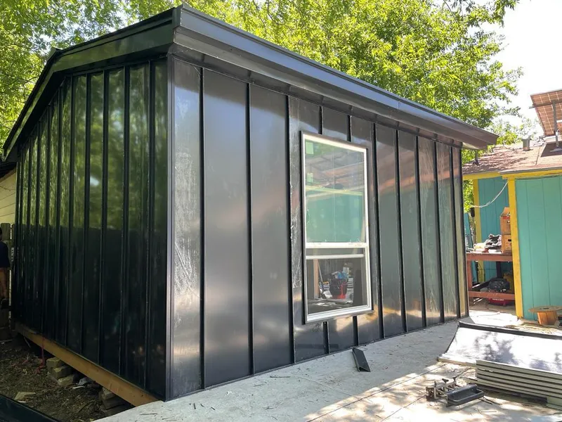 Black standing seam metal wall panels for Metal Roof Installation in Genoa